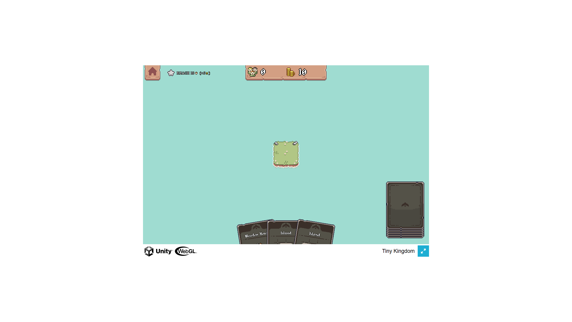 Player strategically placing cards to grow their kingdom in Tiny Kingdom city-building game